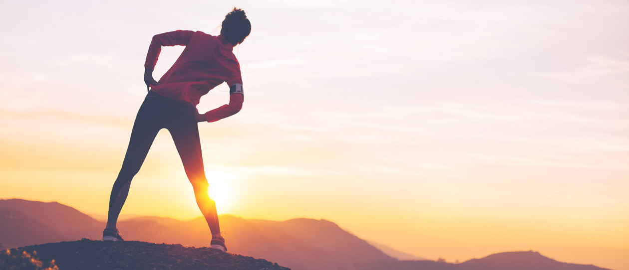 Woman stretching outdoors before a run