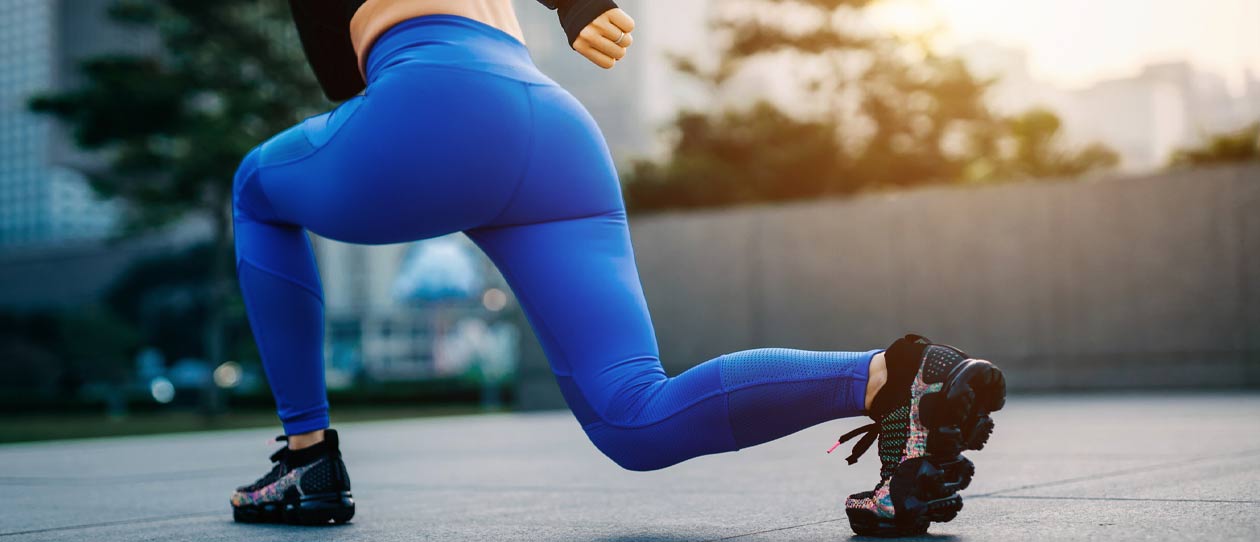 Female runner doing a walking lunge