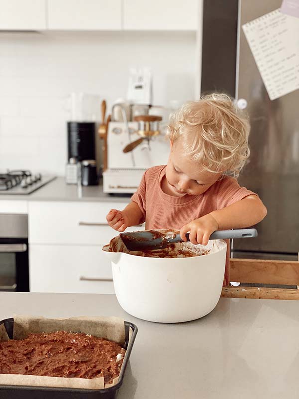 Licking the mixing bowl after mum and dad make sweet potato brownies